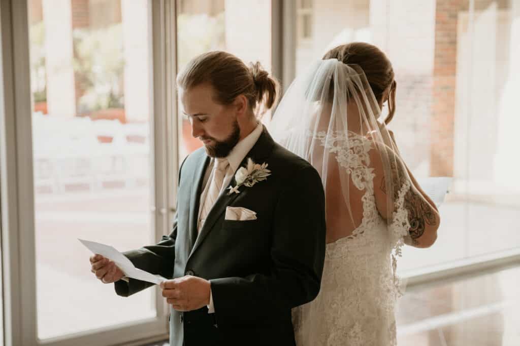 Bride and groom read private vows back to back before wedding ceremony in Kansas City Missouri