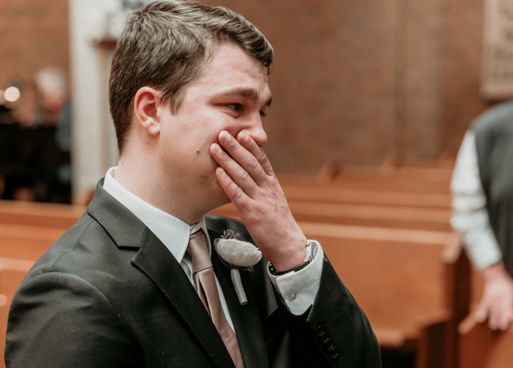 Emotional groom wipes away tears at church wedding ceremony in Kansas City Missouri