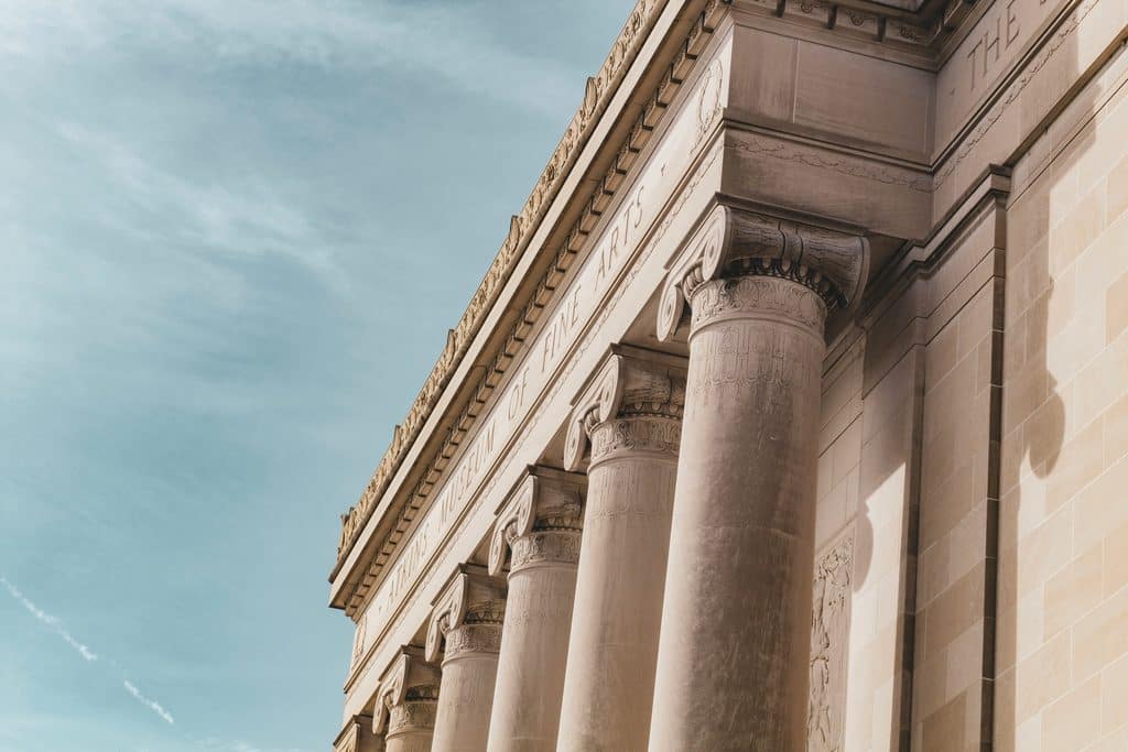 Limestone columns of the Nelson-Atkins Museum of Art in Kansas City against a blue sky